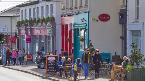 Photo of a local street in one of many Wicklow towns with passers by enjoying their local environment